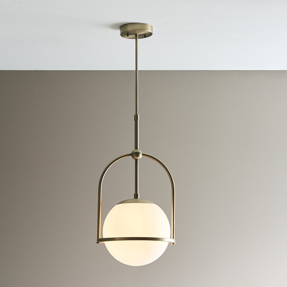 An Opal Glass Single Pendant in Antique Brass