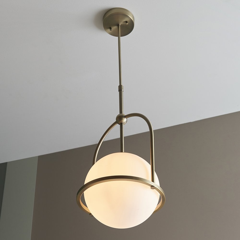 An Opal Glass Single Pendant in Antique Brass