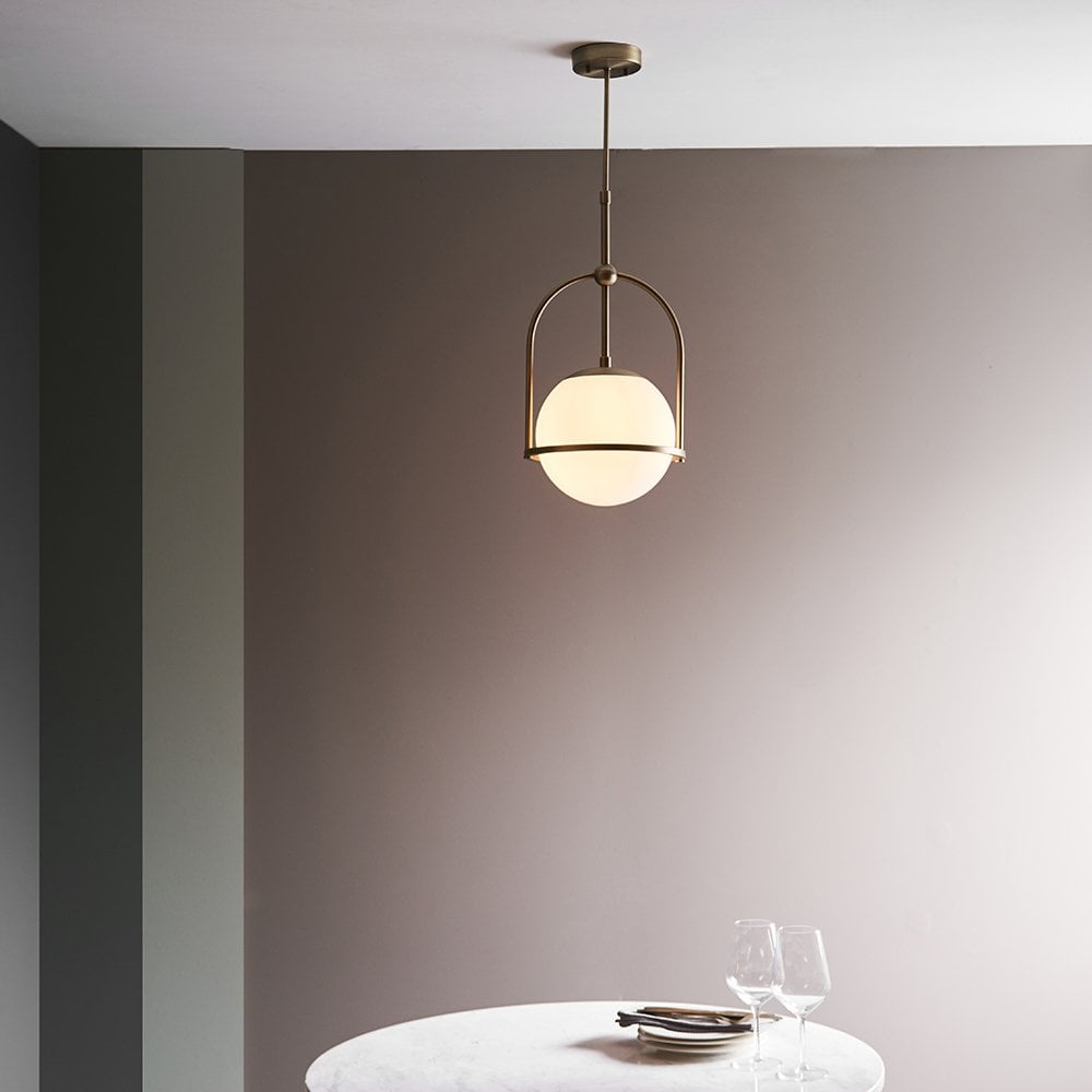 An Opal Glass Single Pendant in Antique Brass