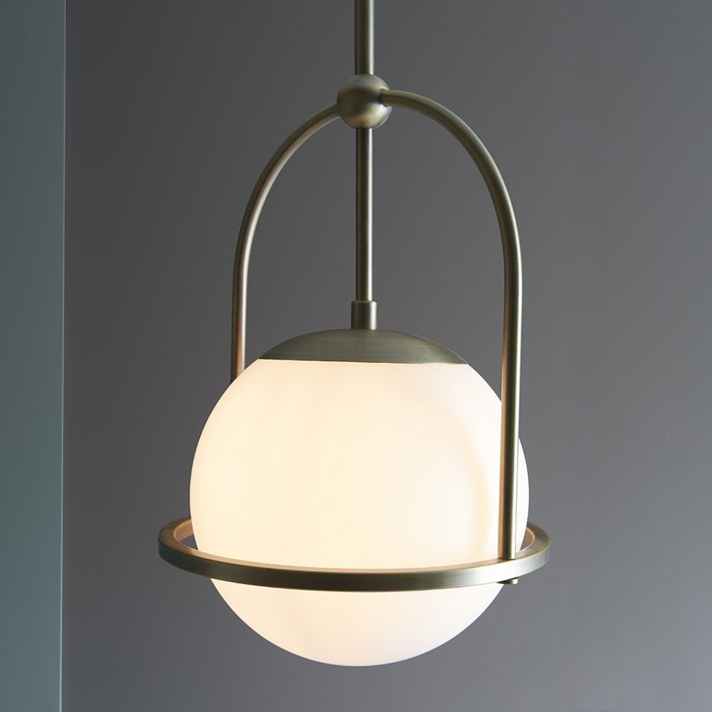 An Opal Glass Single Pendant in Antique Brass