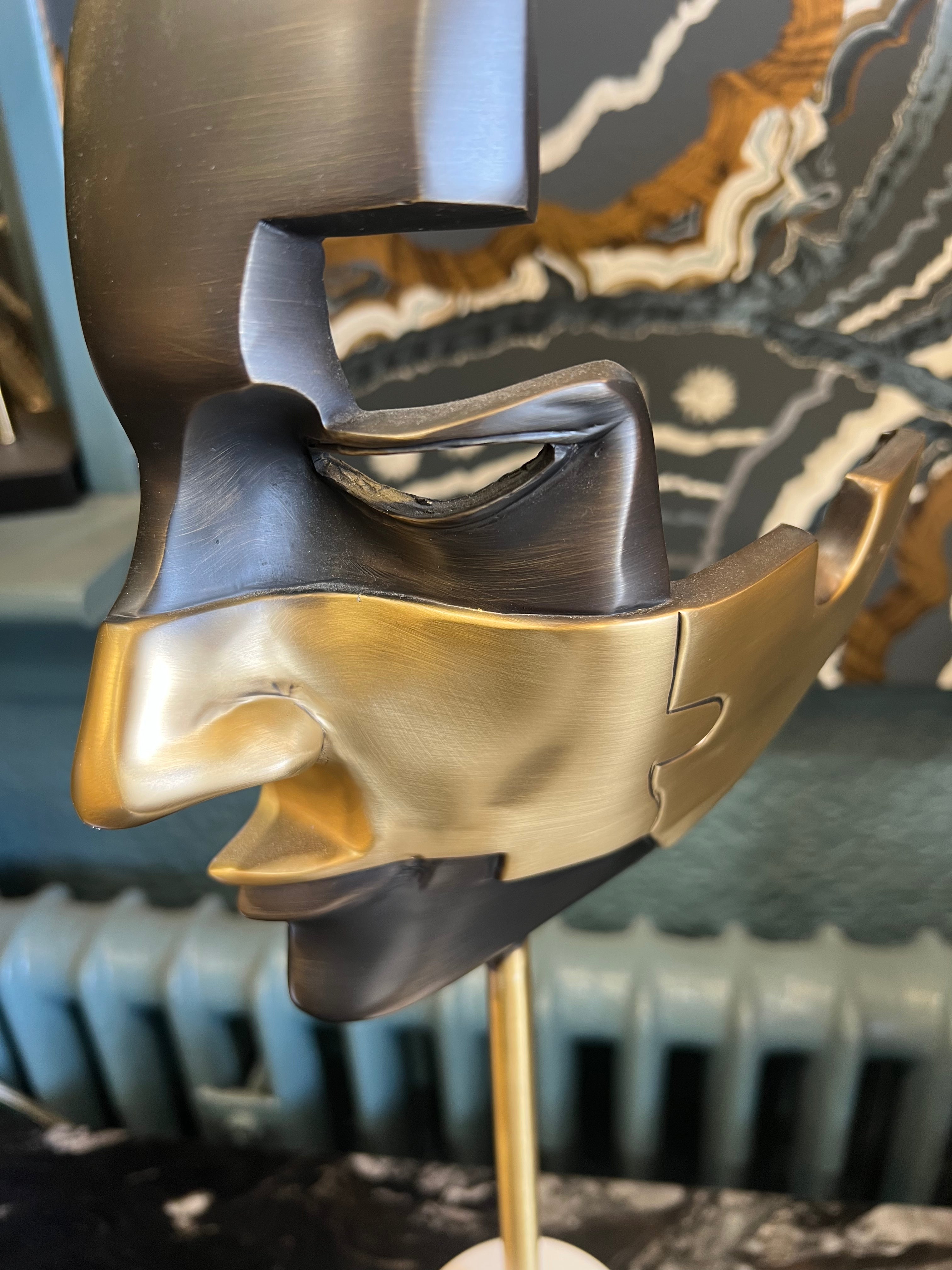 Small Black and Gold Mask on Stone Base
