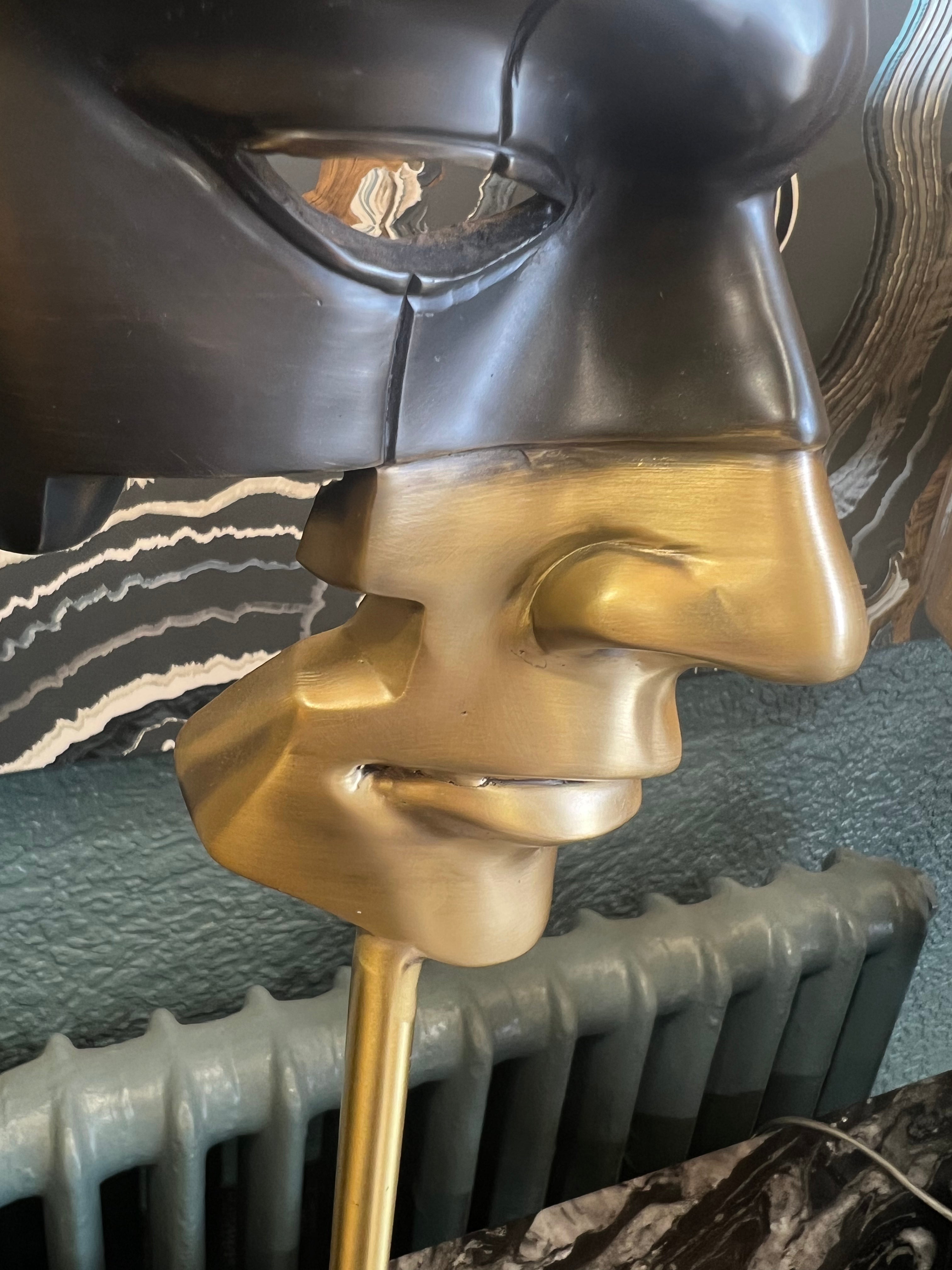 Large Black and Gold Mask on Stone Base